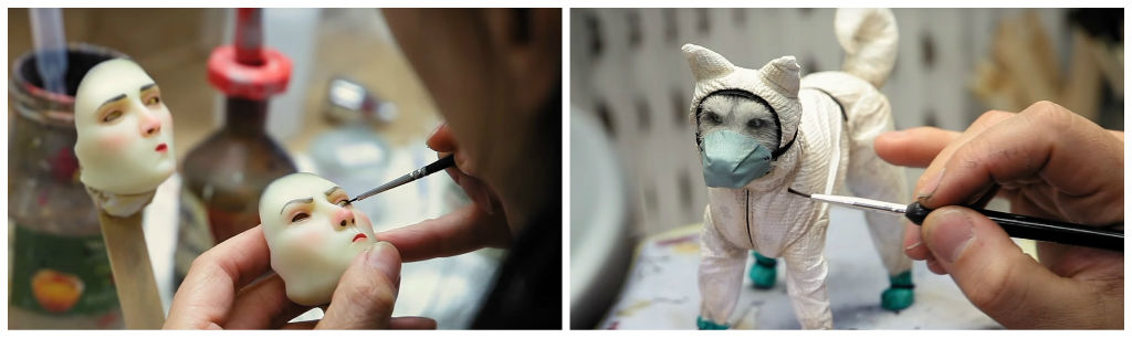 Painting details on the ‘bunny suit’ dog puppet and one of the human replacement faces.&nbsp;&nbsp;Images courtesy Fox Searchlight.