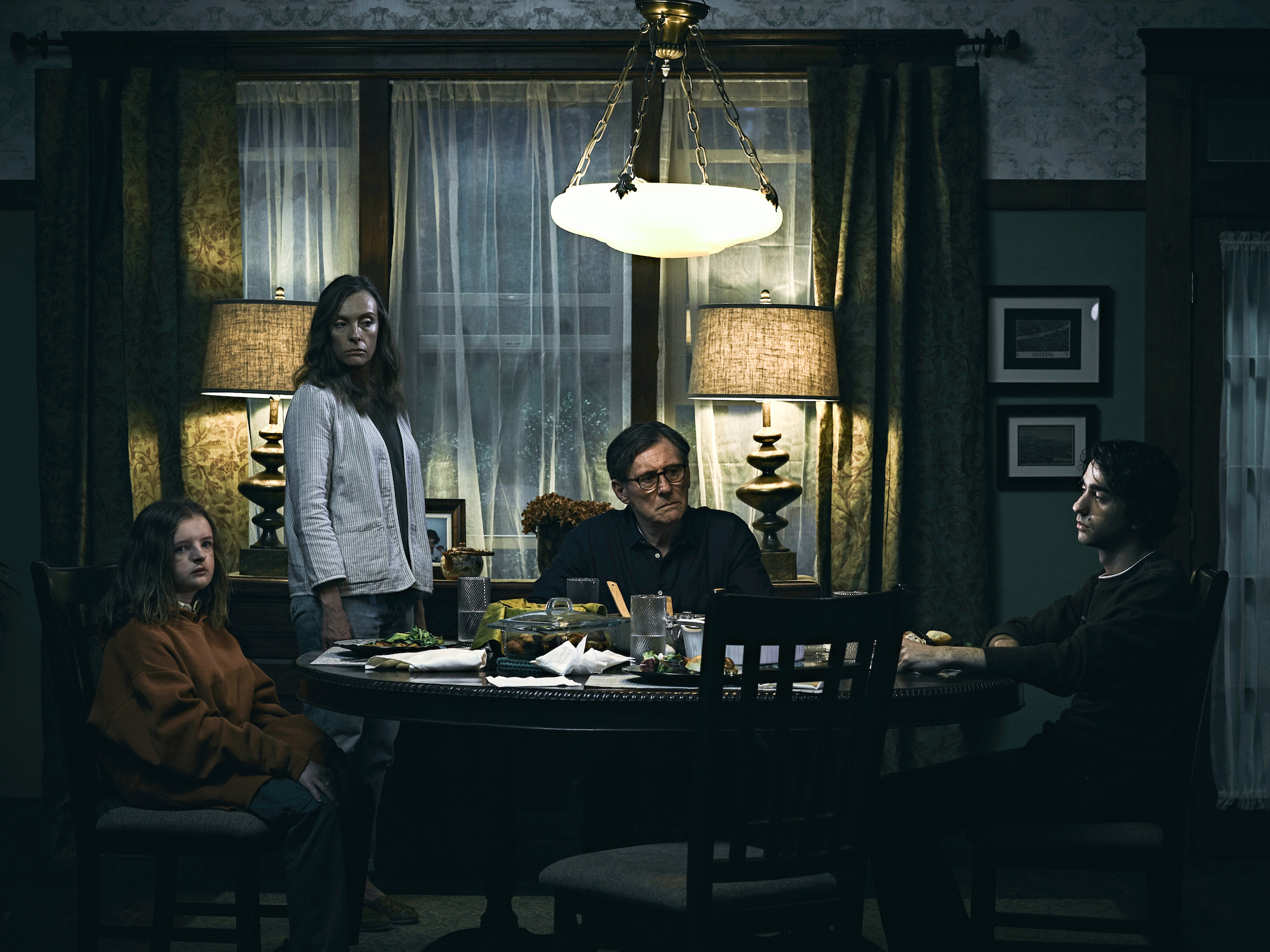 Milly Shapiro, Toni Collette, Gabriel Byrne, and Alex Wolff.  Photo by James Minchin, courtesy of A24.