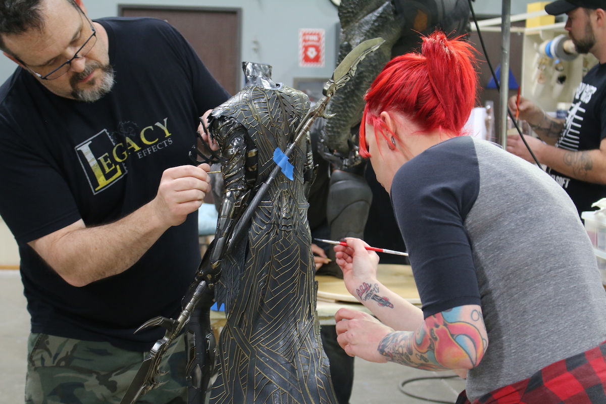 Trevor Hensley and Chloe Sens paint the Corvus Glaive maquette. Images courtesy Legacy Effects