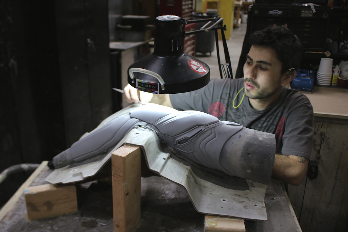 Master moldmaker Tony Contreras works on one of the arms of the Mark 50 suit. Image&nbsp;courtesy Legacy Effects