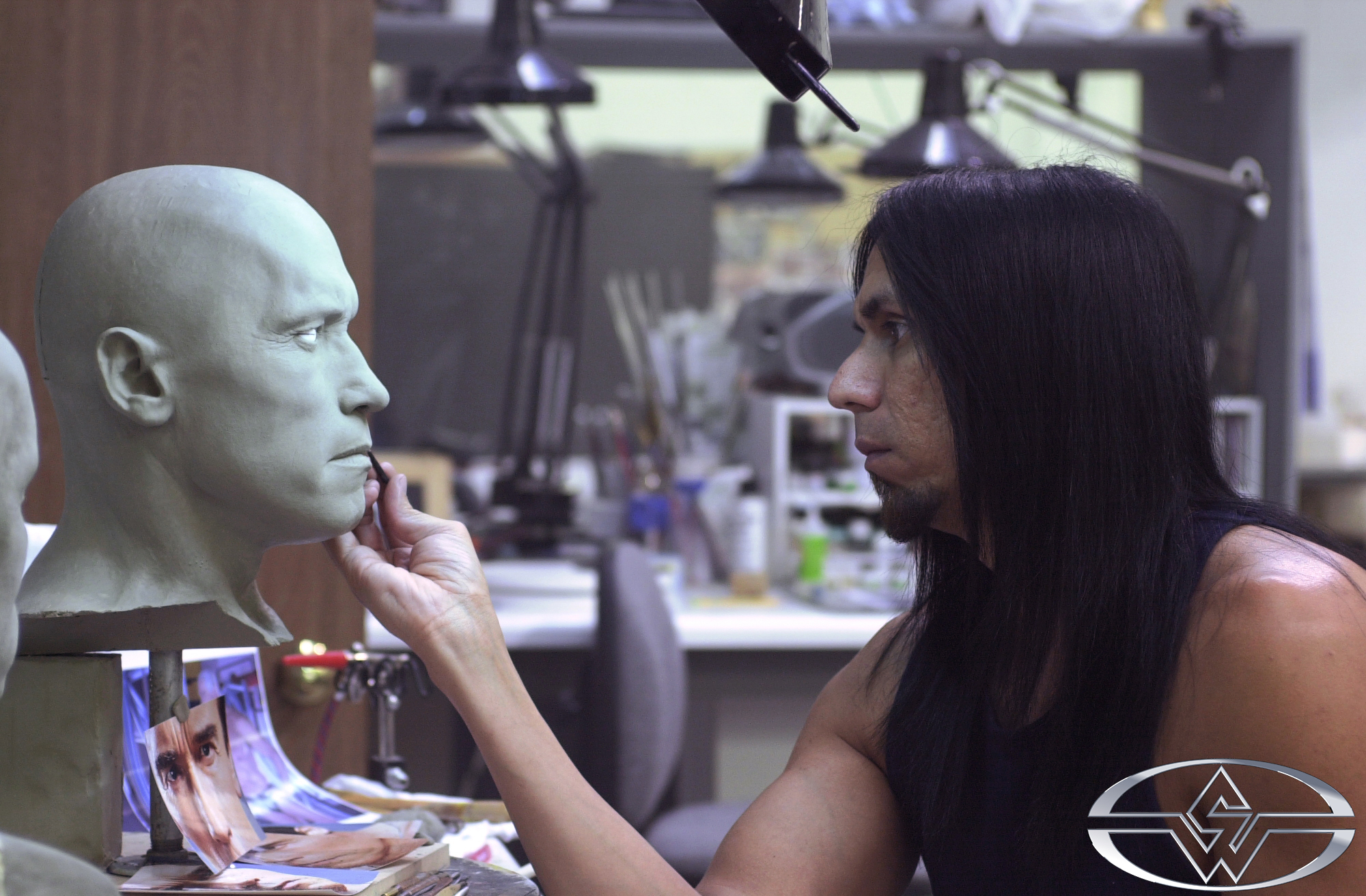 Joey Orosco cleans up a clay press of the molded Arnold cyberscan.