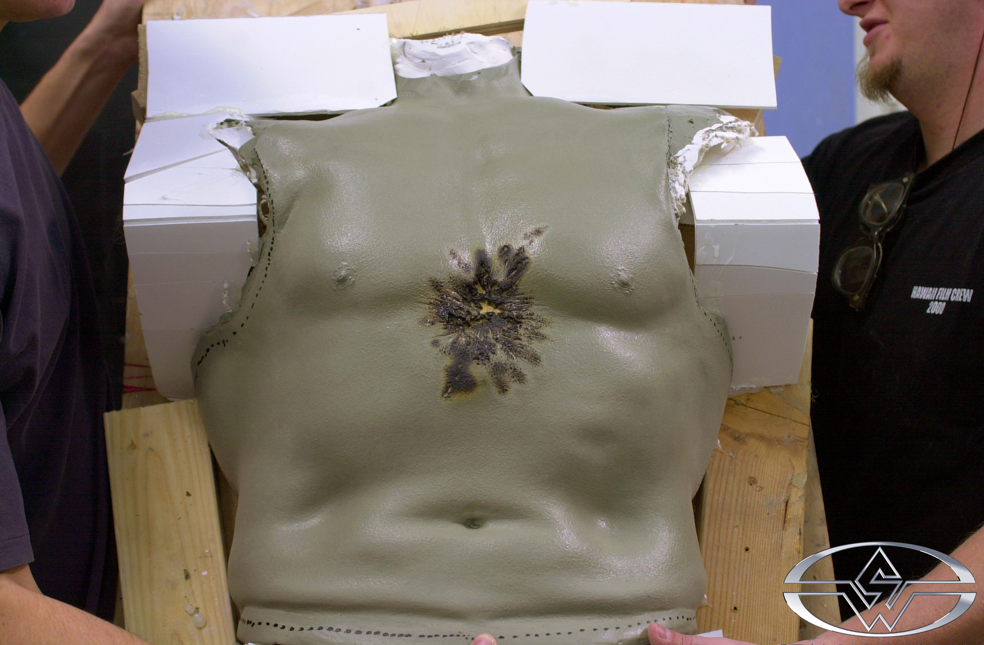 SWS artists prepare to mold a lifecast of Arnold's torso with damage added.