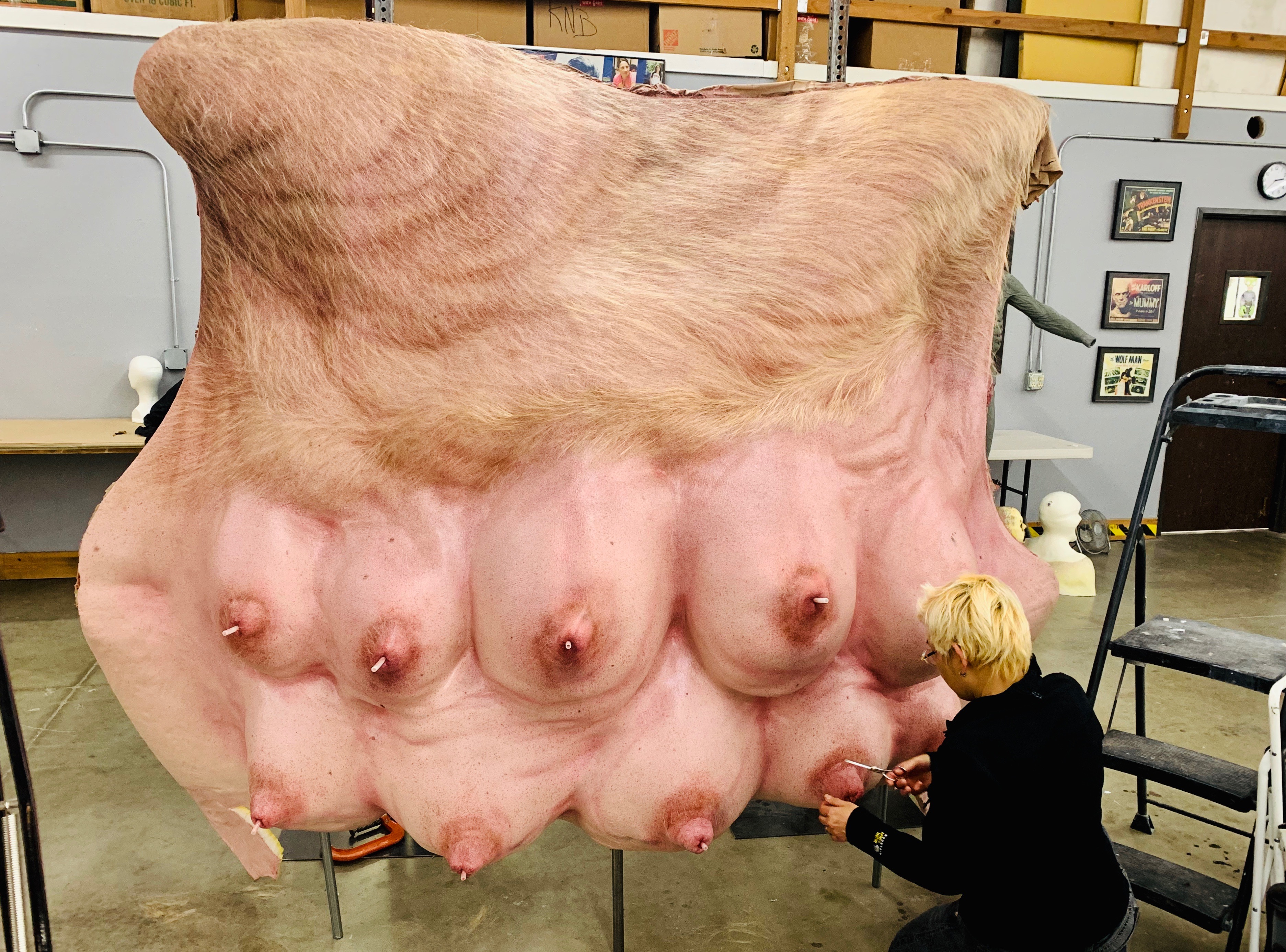 Khanh Trance punches hair in the giant sow's teat. Image courtesy KNB EFX/FX Network
