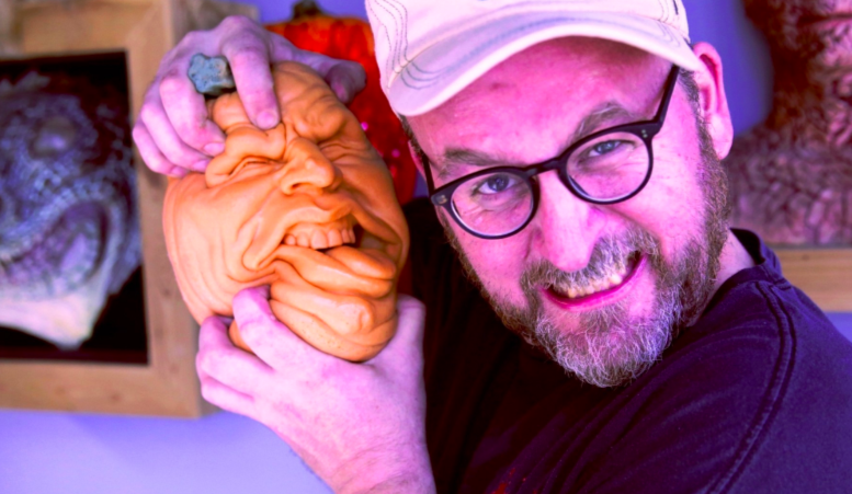 Special effects artist Todd Masters and one of his "Oh Lantern Family" foam rubber pumpkin toys.