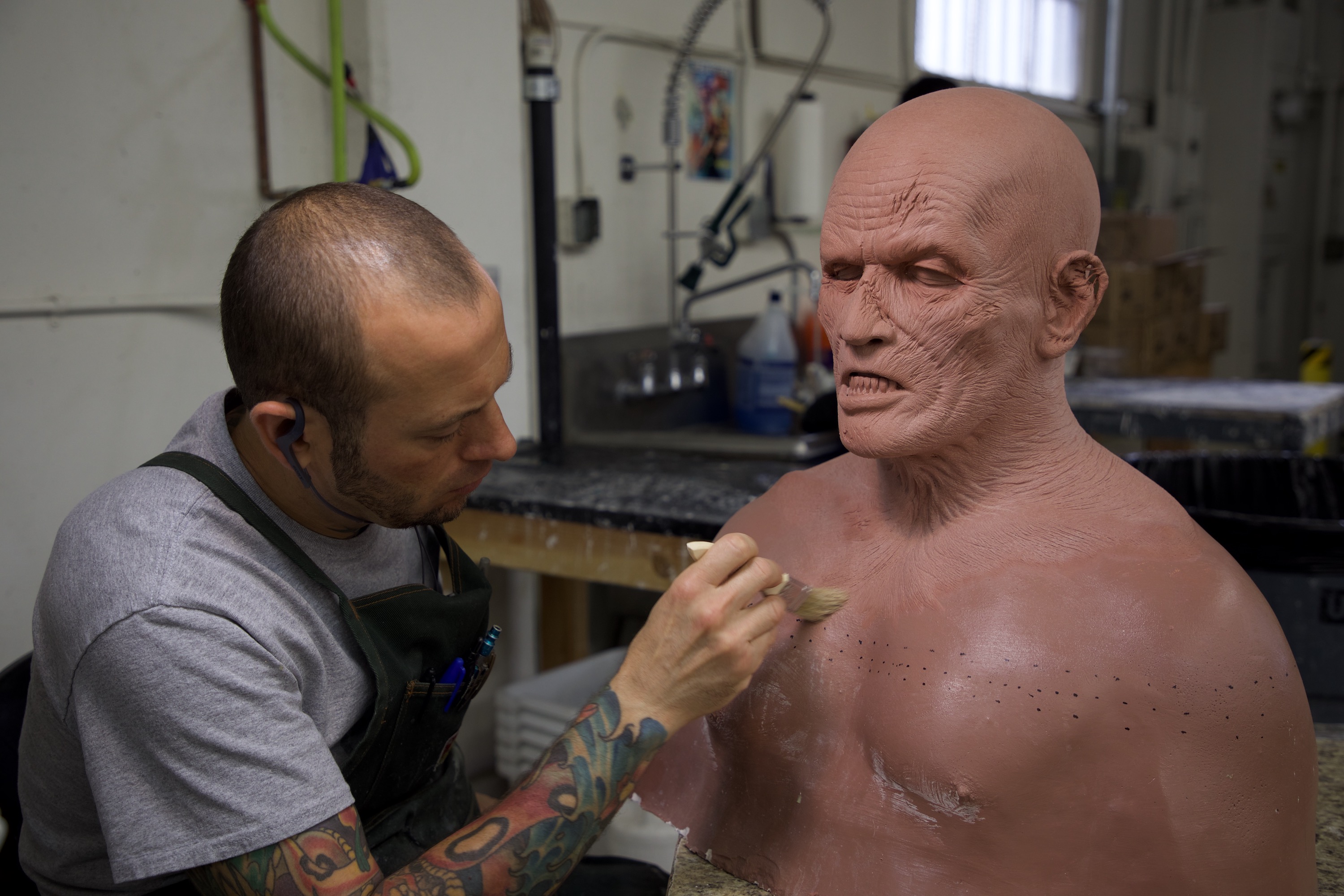 Mold Maker Michael Williams preps an 'Alpha' makeup sculpture for molding.  Image courtesy Fractured FX/Netflix.