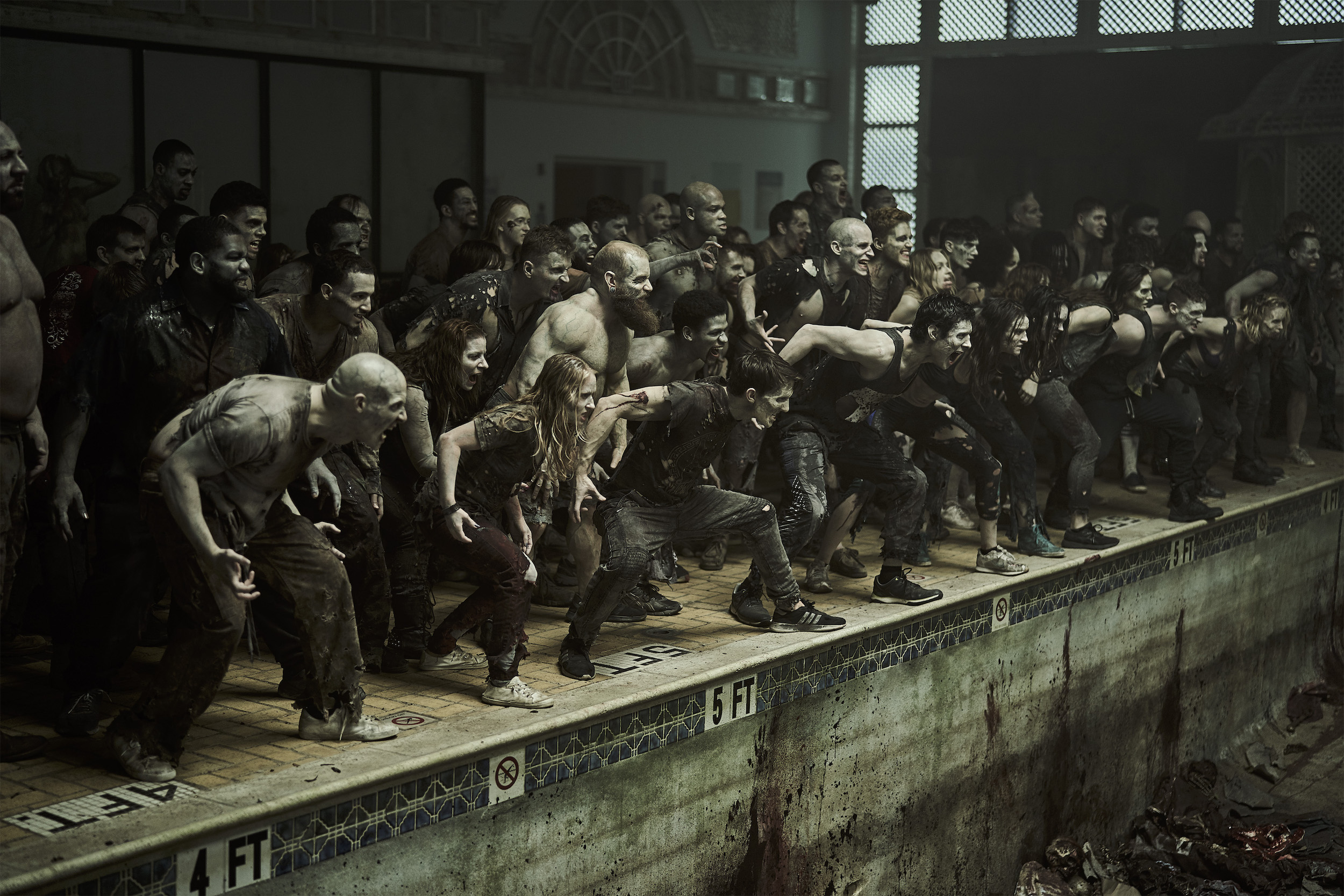 A bloodthirsty mob of 'Alpha' zombies in the King and Queen's lair.  Image courtesy Netflix.