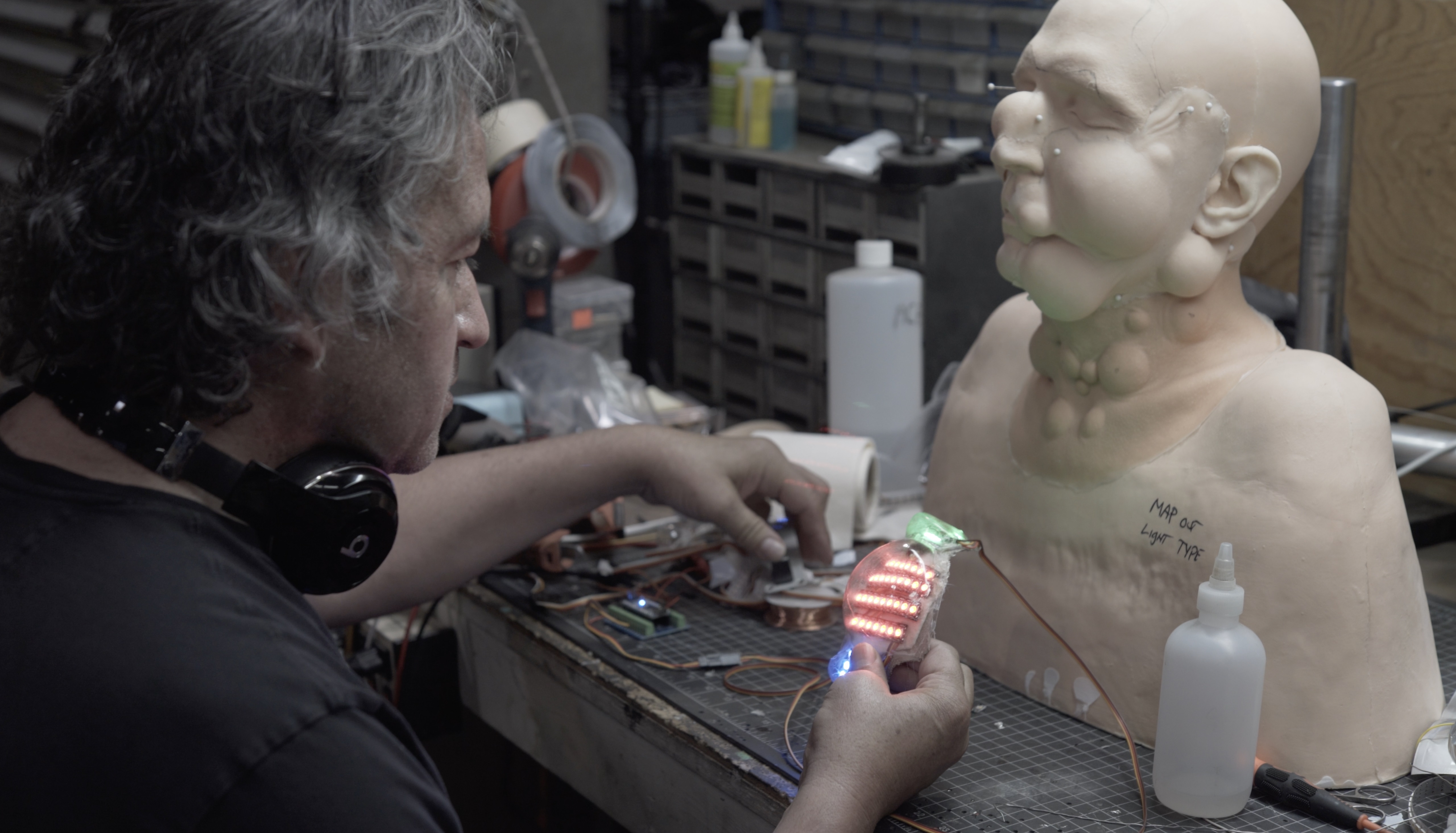 Legacy Effects mechanic David Covarrubias testing the LED array for one of the Polka-Dot Man appliances. Image courtesy Legacy Effects/Warner Bros.