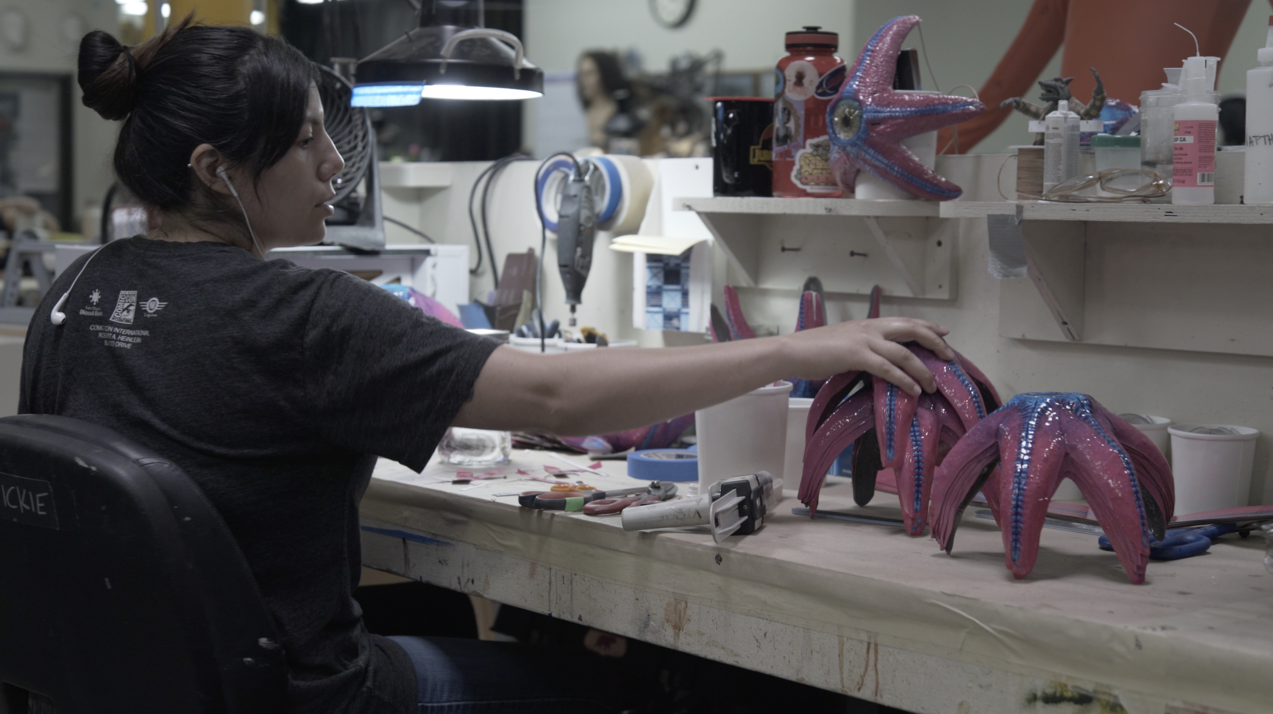 Vickie Fernandez works on vacuformed starfish masks at Legacy Effects. Image courtesy Legacy Effects/Warner Bros.