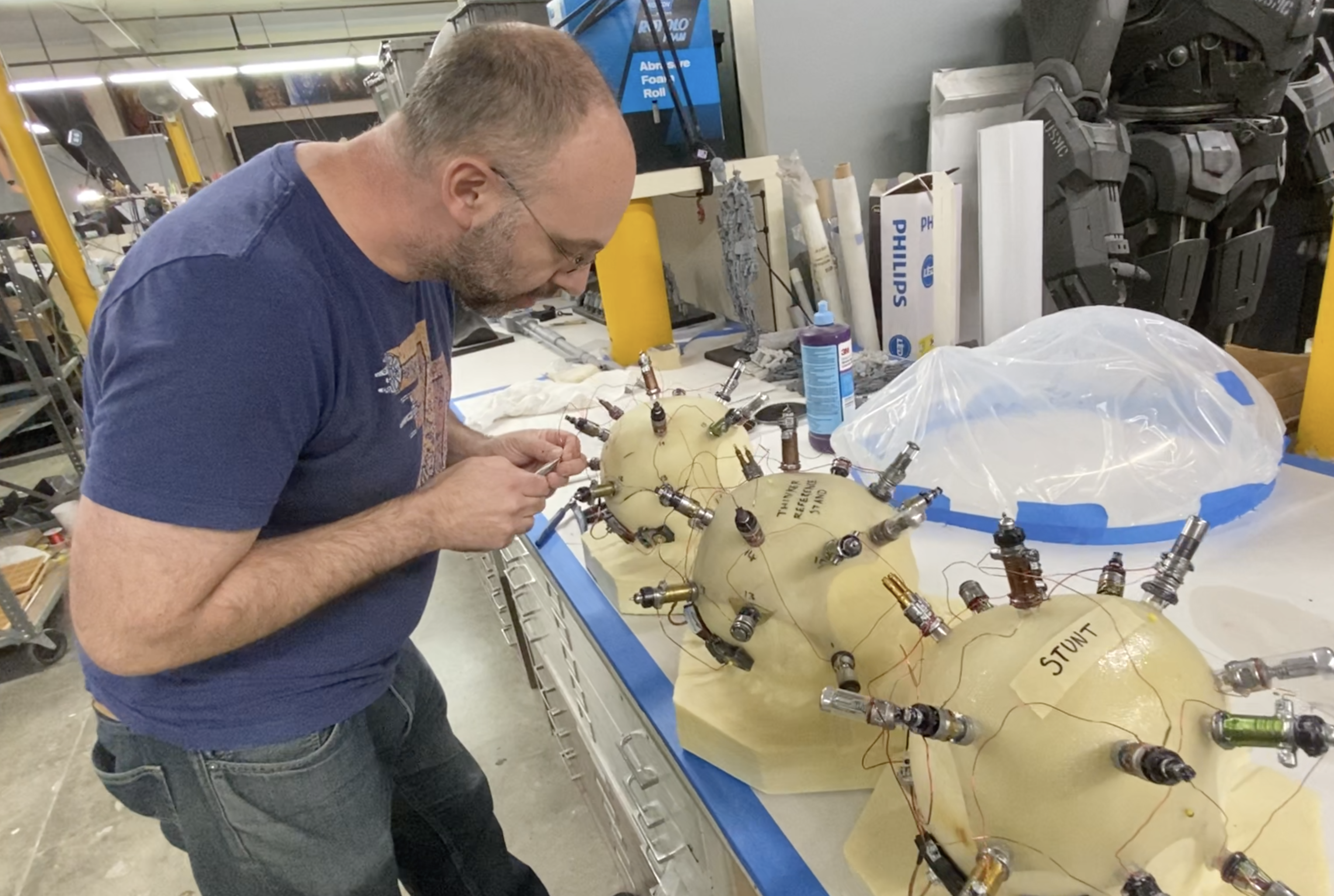 Jonathan Faber working on a series of Thinker skull caps. Image courtesy Legacy Effects/Warner Bros.