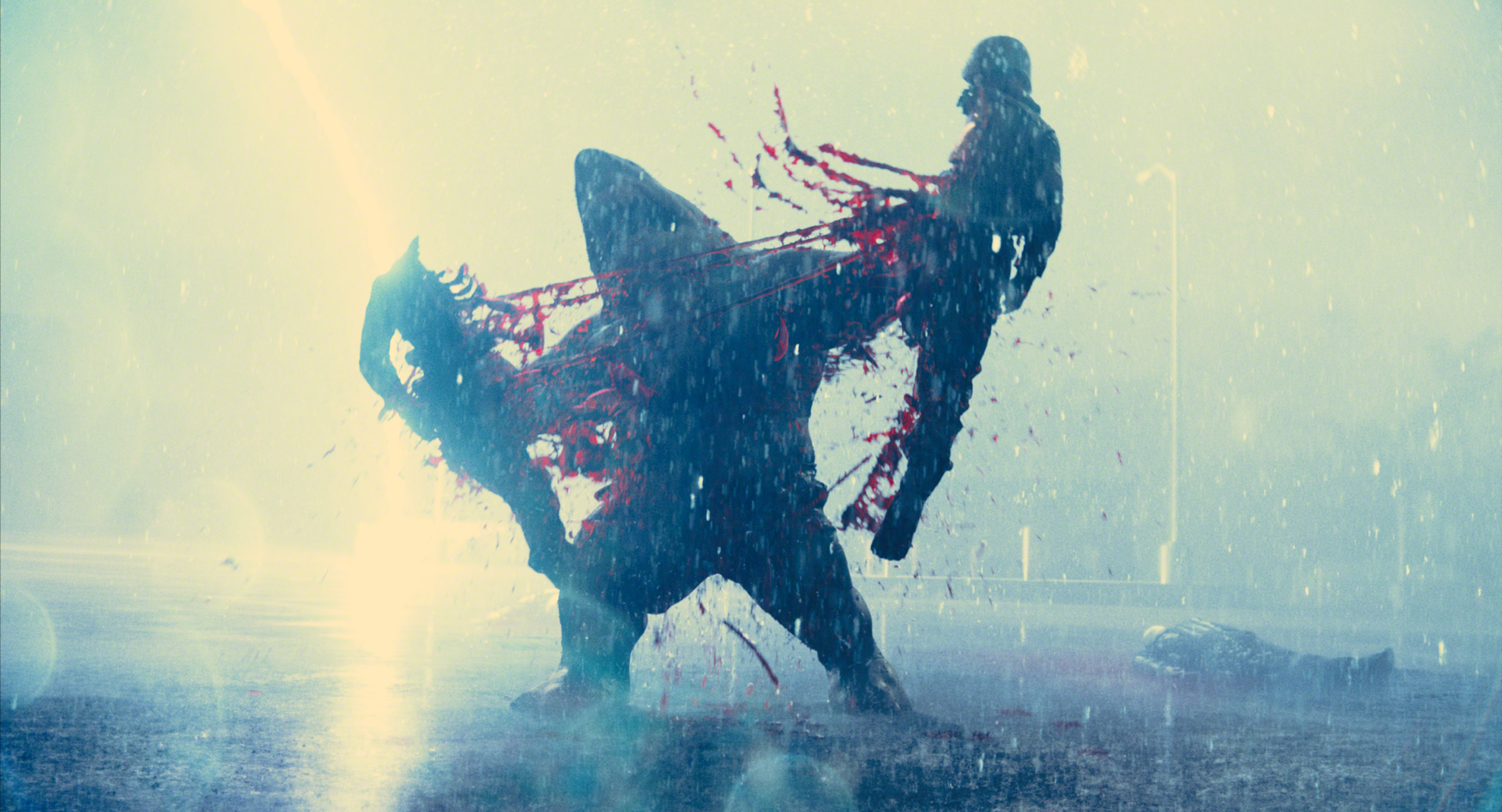 The digital King Shark rips Legacy’s practically rigged body in half. Image courtesy Warner Bros.