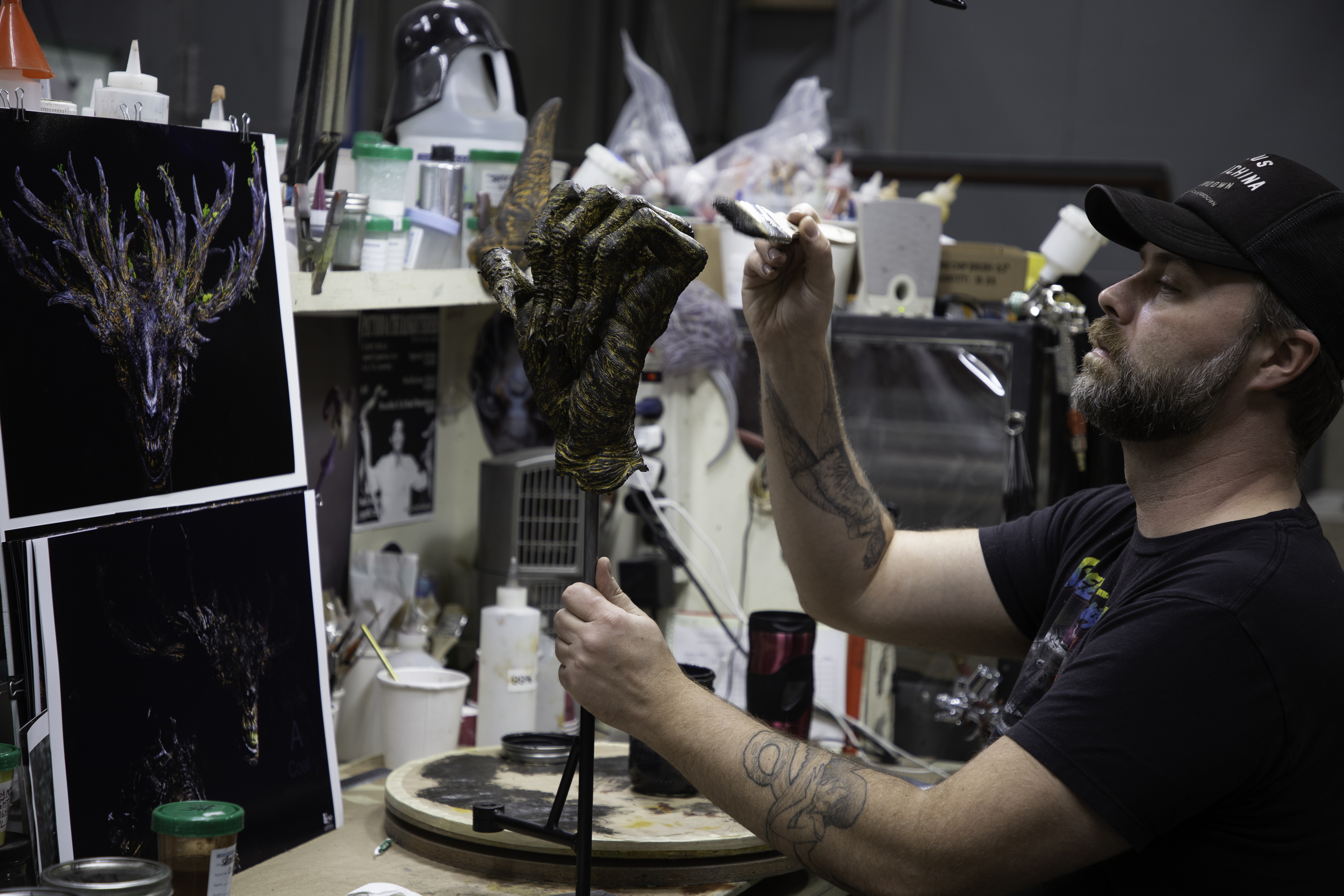 Ryan Pintar paints a Wendigo hand. Image courtesy Legacy Effects/Fox Searchlight.