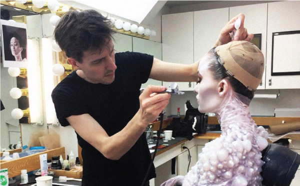Arjen airbrushing the Gozer look on Olivia Wilde during application. Image courtesy Arjen/Sony Pictures.