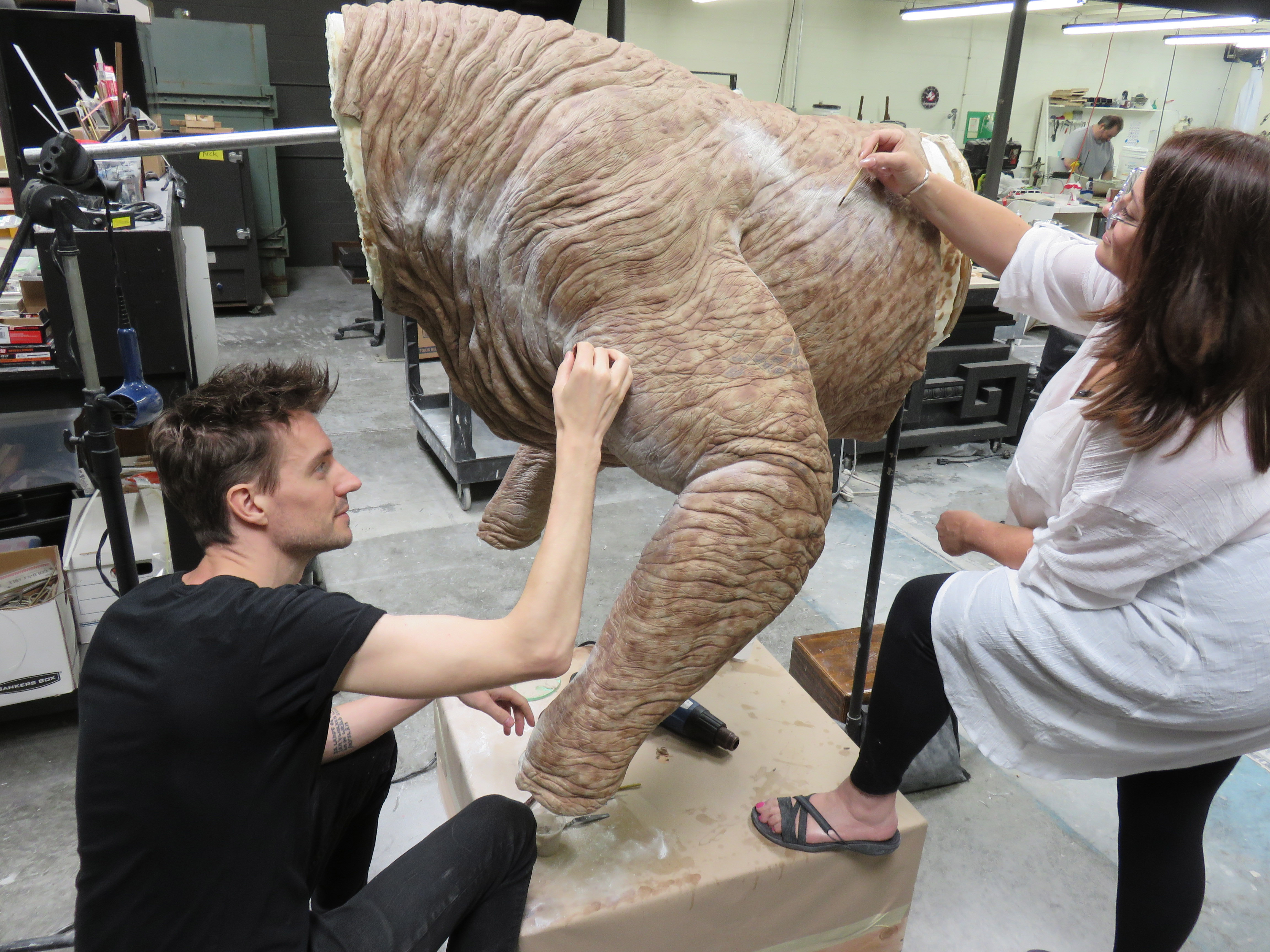 Arjen and fabricator Beth Hathaway patch the seams on the Terror Dog foam latex skin. Image courtesy Arjen/Sony Pictures.