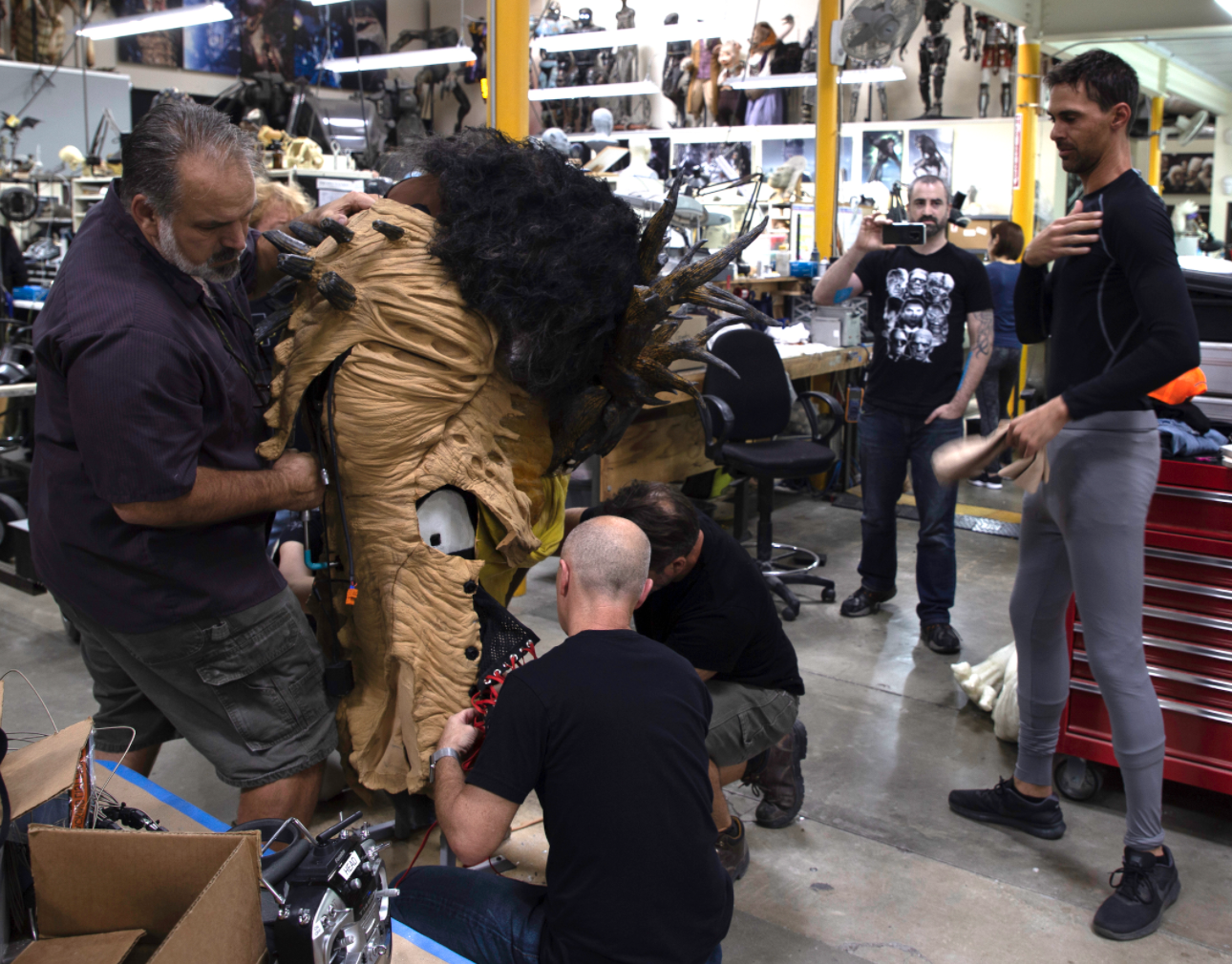 L-R, Rich Haugen, Lindsay Macgowan, Rob Ramsdell and suit performer Dorian Kingi prepare to test the Wendigo suit. Image courtesy Legacy Effects/Fox Searchlight.