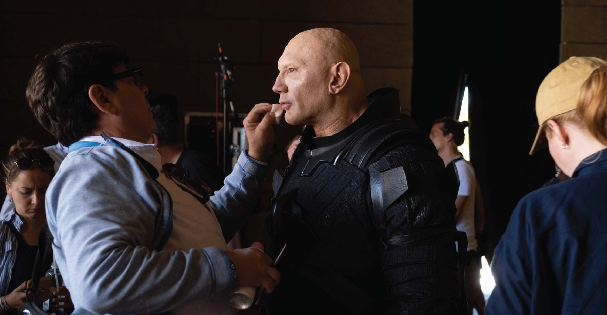 Donald Mowat on-set during filming doing makeup checks on Dave Bautista. Image courtesy Donald Mowat/Warner Bros.
