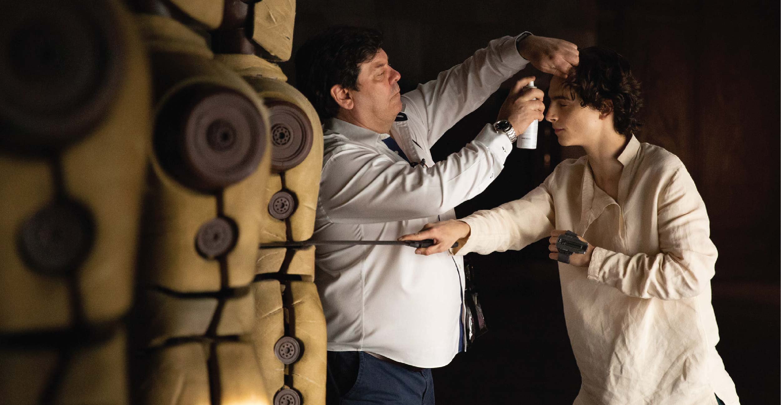 Donald Mowat applying sweat to Timothée Chalamet on-set. Image courtesy Donald Mowat/Warner Bros.