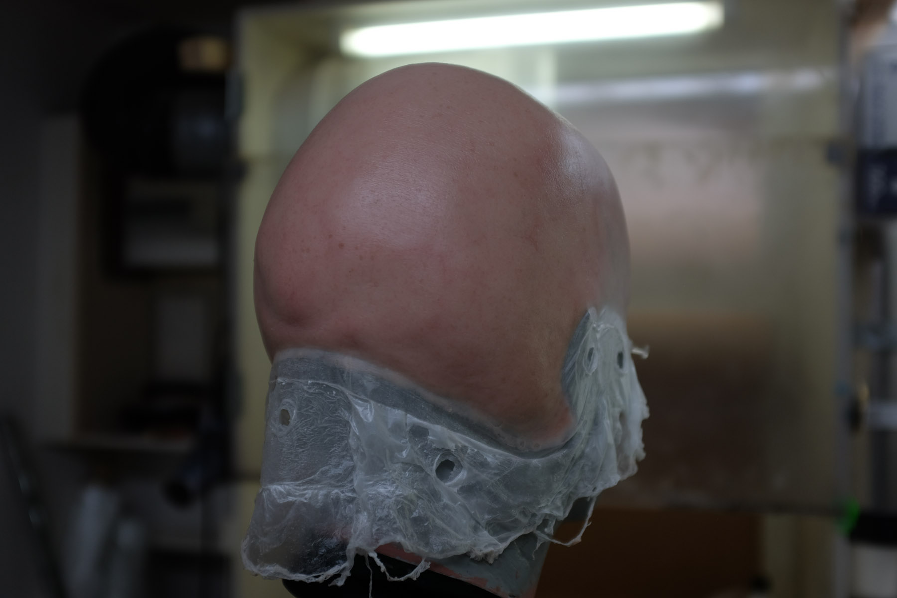 A pre-painted silicone head appliance for the 'Baron' ready for application. Image courtesy Donald Mowat/Warner Bros.