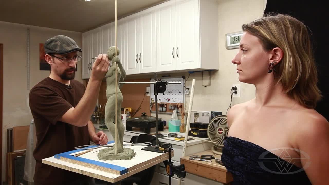 Alfred Paredes prepares to work on the face of his sculpture, referencing model Aubriana Zurligen.