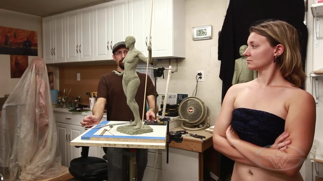 Alfred Paredes compares his sculpture to his model Aubriana Zurligen.