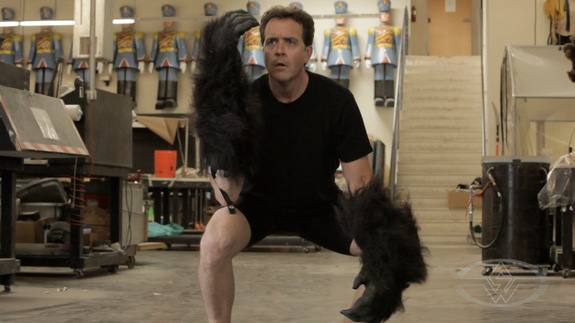 Tom demonstrates how he masters the mannerisms of a Gorilla: one of his specialties.
