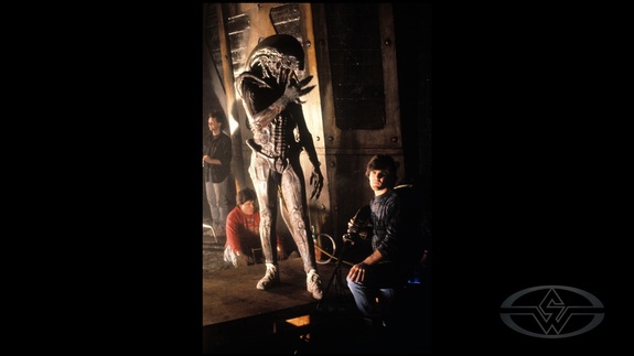Alec Gillis watches over his partner, Tom Woodruff Jr., who's suited up and ready to strike fear into the occupants of this spaceship.