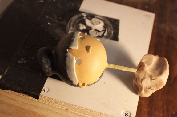 A puppet head in progress. The eyes were small spheres held in place by clay eyelids.