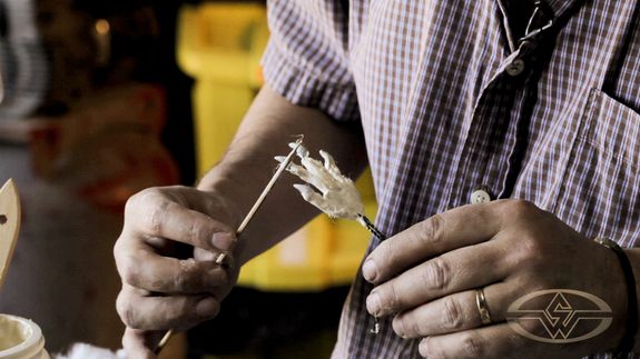 Shannon Shea uses a skewer to wrap more wet fibers before creating the 'veins & sinew' out of more liquid latex.