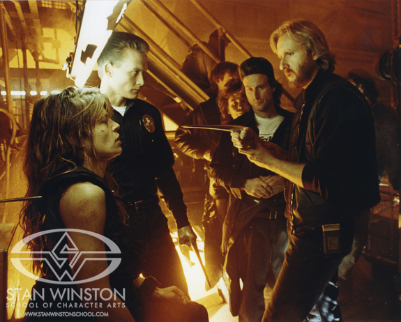 On set of Terminator 2. John Rosengrant watches James Cameron directing Linda Hamilton & Robert Patrick.