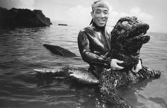 Haruo Nakajima is all grins in spite of the challenges of performing in the water in a 200-pound Godzilla suit.
