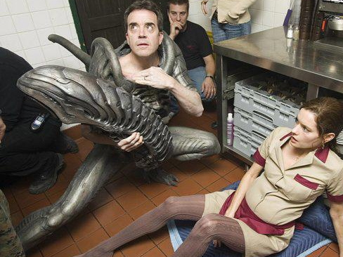 Monster Suit performer Tom Woodruff, Jr. in a variety of painful positions.