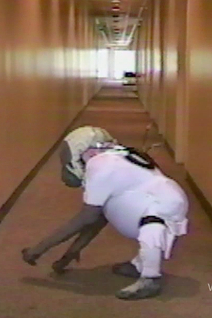 Actor Verne Troyer tests out the toddler gorilla arm extensions and muscle suit.