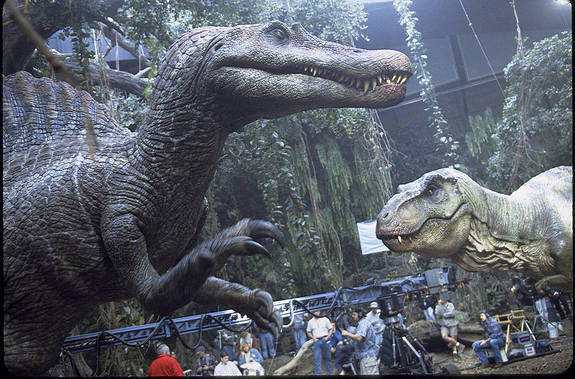 The Spino looms HUGE over the set with the T-Rex watching warily on.