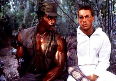 Carl Weathers (with prosthetic arm stump) with Jean-Claude Van Damme (wearing the Original Predator arm).