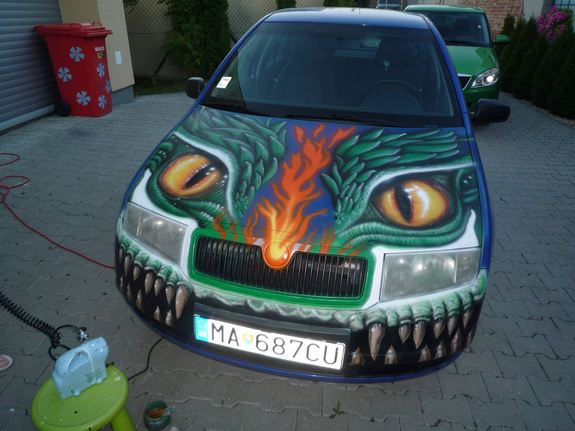 Emka's talent knows no bounds; here, she decorates the family car.