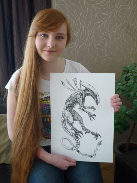 Emka with her alien. Once she started drawing imaginary creatures, she never went back.