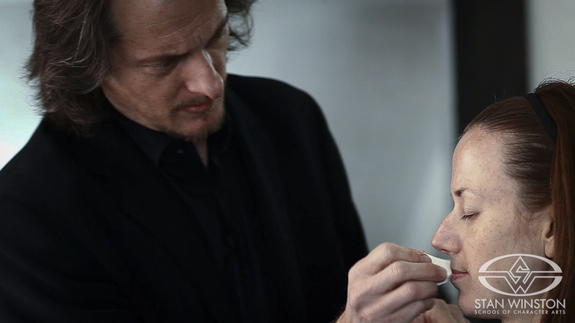 Bill Corso applies makeup from the 36 color Fard Creme master palette to the actress.)