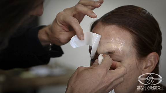 Using both aging makeup and prosthetic transfers, Bill Corso transforms the actress into a 60-something-year-old woman.