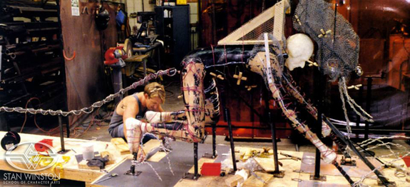 Mark Crash McCreery builds the full-size Kothoga sculpting armature around suit performer Vincent Hammond's body cast.