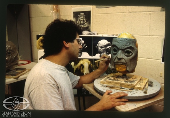 Bill Basso sculpts the Sayer of the Law's ritual mask.