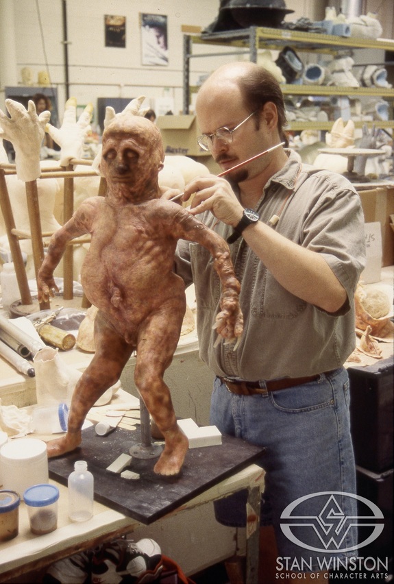 Bruce Spaulding Fuller works on the Majai&nbsp;full-body prosthetics designed for Nelson de la Rosa, the smallest actor in the world at that time. Because Marlon Brando wanted him to be in many more scenes with Dr. Moreau, Shane Mahan’s team had to produce a more complex and detailed make-up for Majai's character, with the wardrobe department providing matching miniaturized versions of Dr. Moreau's clothes.