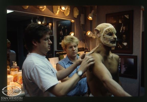 Mark Maitre and Shane Mahan apply the leopard-man makeup to actor Mark Dacascos.