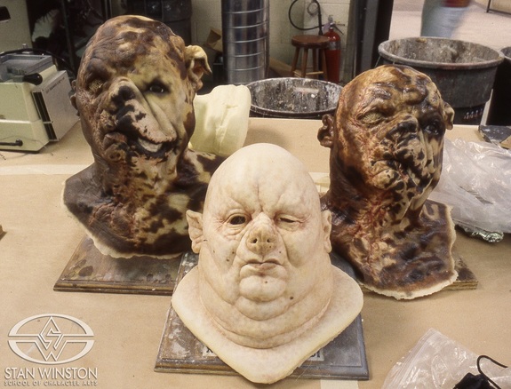A trio of finished beast-people masks. One of the dog masks, 'mask 46,' went missing, and later it turned out that Richard Stanley had been secretly visiting the set wearing it.