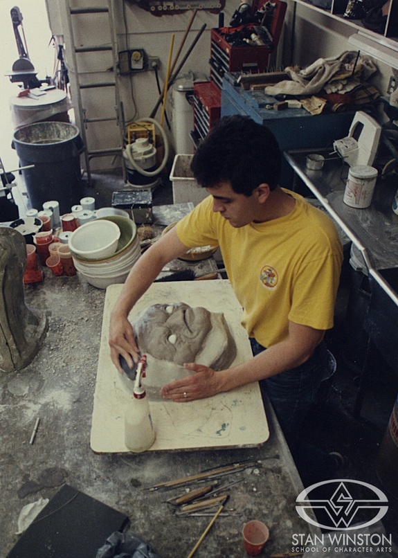 Tom Woodruff, Jr. prepares the Supreme Being face sculpture for molding.