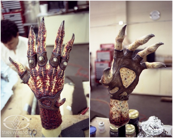 The painted, finished hands, with Jordu Schell in the background.
