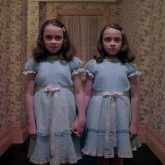 The terrors of The Shining's Overlook Hotel include the dead twins and the woman from Room 237.