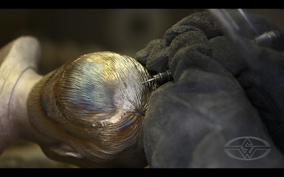 AFAF's Servando 'chases' the metal, restoring hair detail to a welded section of the bust.
